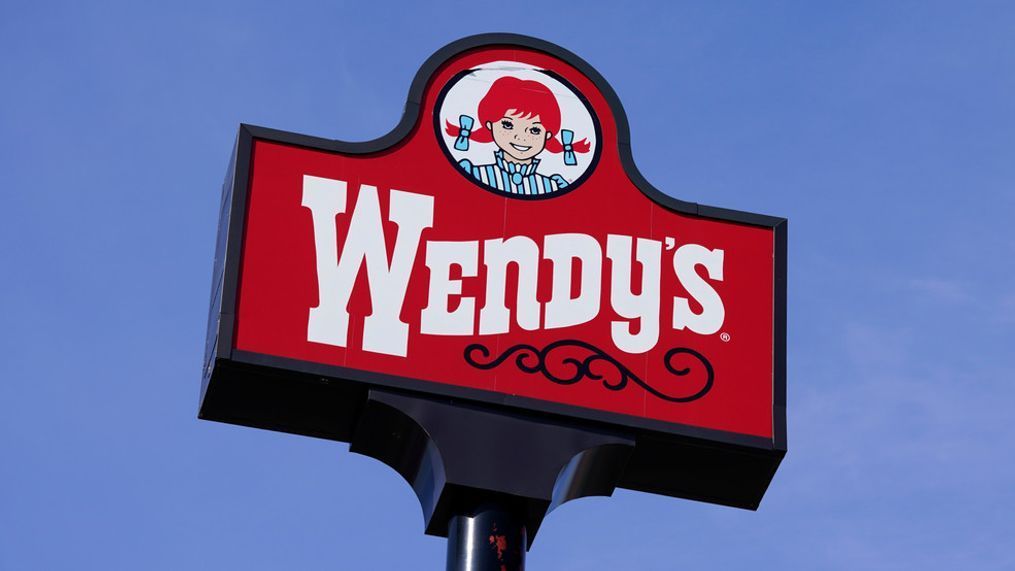 FILE - A sign stands over a Wendy's restaurant on Feb. 25, 2021, in Des Moines, Iowa. (AP Photo/Charlie Neibergall, File)