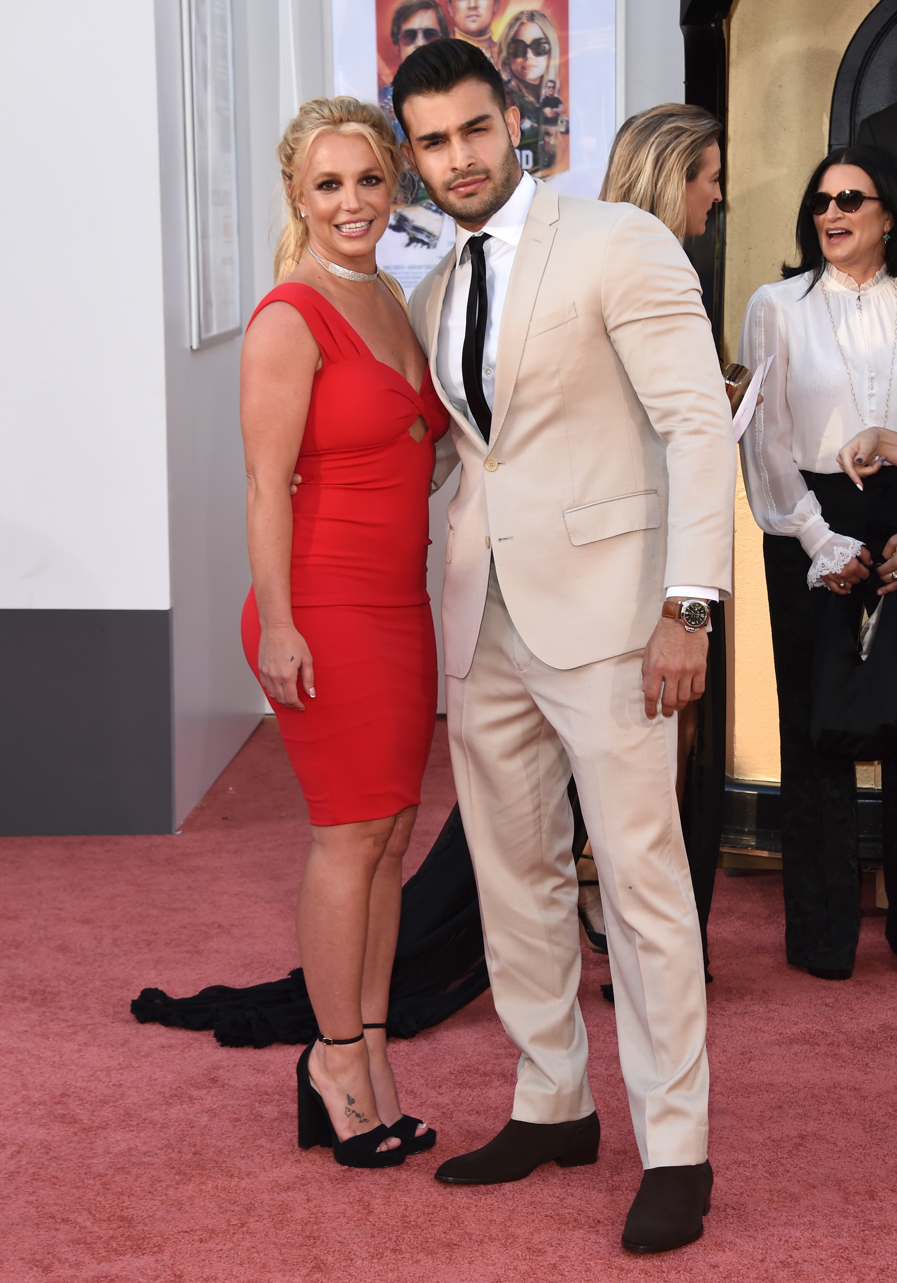Britney Spears and Sam Asghari arrive at the Los Angeles premiere of "Once Upon a Time in Hollywood," at the TCL Chinese Theatre, Monday, July 22, 2019. Spears announced on Instagram on Sunday, Sept. 12, 2021, that she and Asghari are engaged. The couple met on the set of her “Slumber Party” music video in 2016.  (Photo by Jordan Strauss/Invision/AP, File)