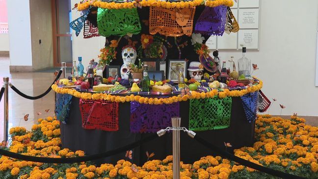 The San Antonio Public Library Foundation created an ofrenda that can be viewed at the Central Library in downtown San Antonio. The altar is filled with images and items of those who attended the Catrina Ball (SBG).