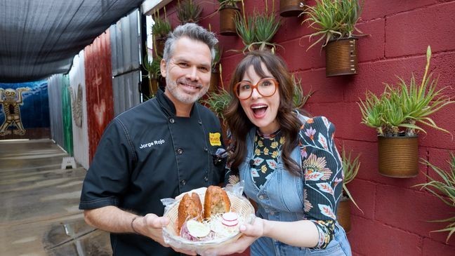 Let's Eat! Host Monti Carlo with Chef Jorge Rojo, just before trying her first award-winning Pork Butt Torta Ahogada from Ro-Ho Pork & Bread in San Antonio, Texas.{&nbsp;}(Amazing American TV)