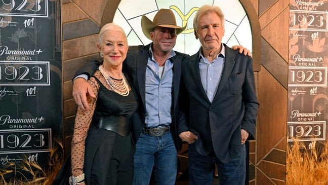 LAS VEGAS, NEVADA - DECEMBER 03: (L-R) Helen Mirren, Taylor Sheridan and Harrison Ford attend the "1923" Las Vegas premiere screening the Encore Theater at Wynn Las Vegas on December 03, 2022 in Las Vegas, Nevada. (Photo by David Becker/Getty Images for Paramount+)