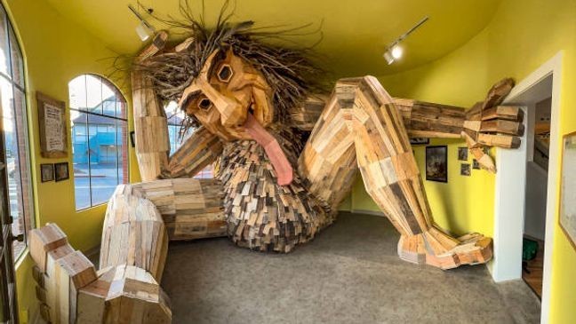 SOLVANG, CA - JANUARY 31:  Renowned Danish artist Thomas Dambo (not in frame) has just completed his first California Troll sculpture made from recycled wood pallets, wine barrels, and other found materials as viewed on January 31, 2025, in Solvang, California. Constructed in the Tower Gallery at the California Nature Art Museum over a 10-day period, this is Dambo's first indoor Troll among the more than 150 sculptures he has created in the United States and around the globe. (Photo by George Rose/Getty Images)