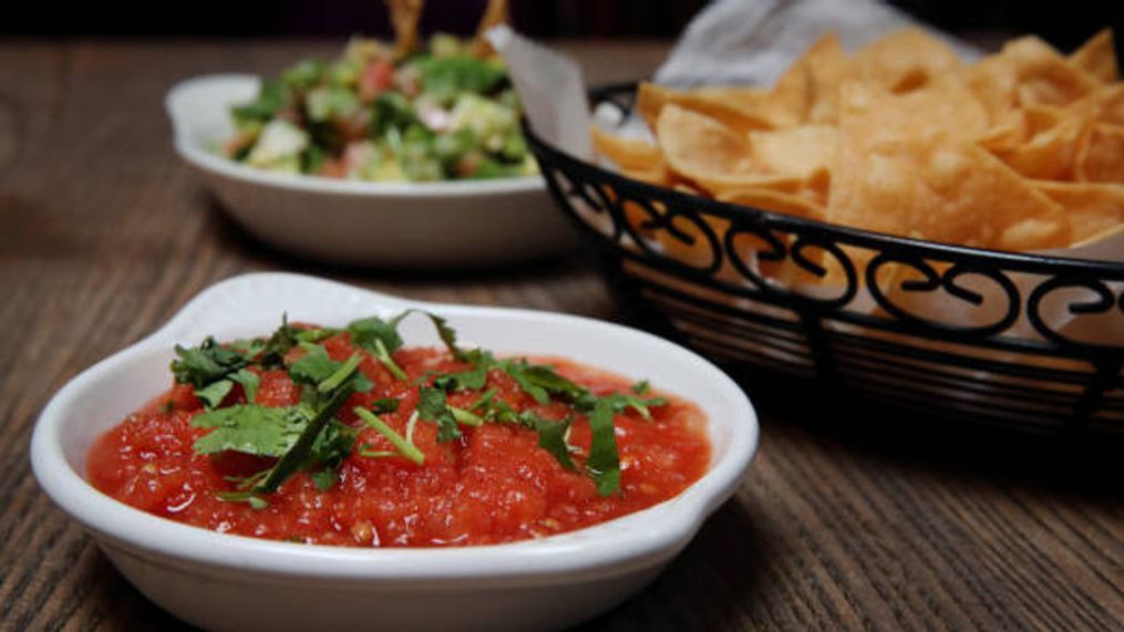 When it comes to Super Bowl Sunday snacks, in Texas, where everything is bigger and bolder, the champion of game day feasts is a classic duo: chips and salsa. (Photo by Craig F. Walker/The Boston Globe via Getty Images)